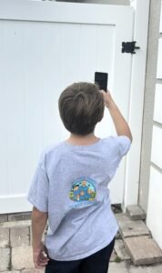 My Poop Troop team taking locked gate picture to send to client